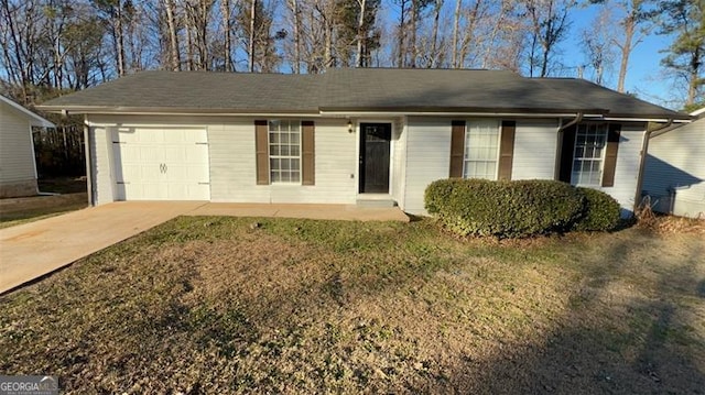 single story home with a garage and a front lawn