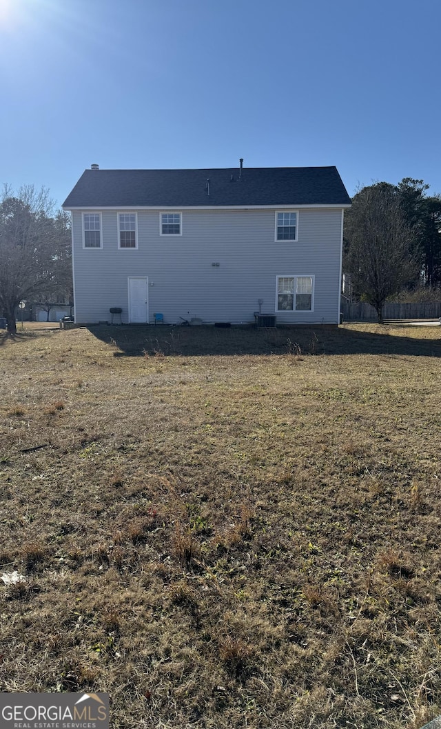 back of house with a yard