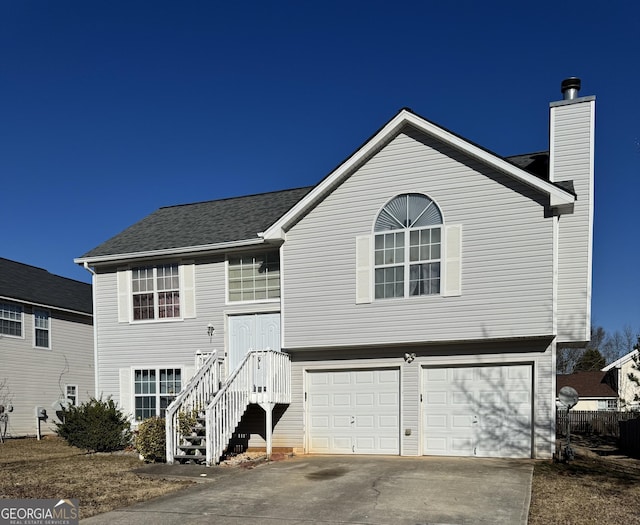 split foyer home featuring a garage