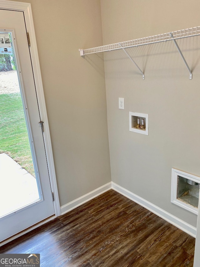 laundry area featuring dark wood-style floors, washer hookup, laundry area, and baseboards