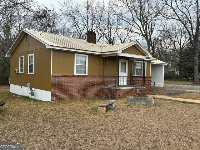 view of front facade with a carport