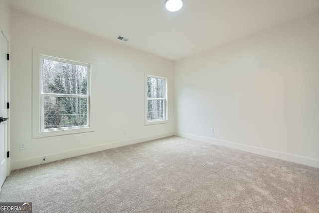 spare room featuring carpet floors