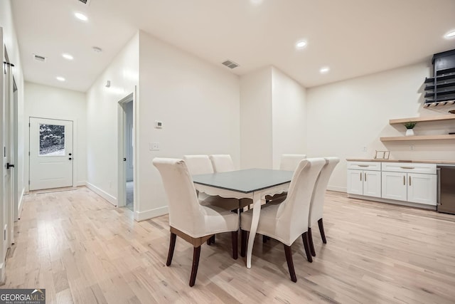 dining area with light hardwood / wood-style floors