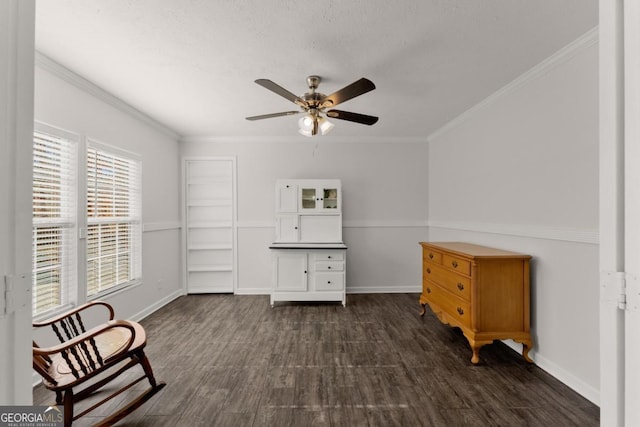 unfurnished room with ceiling fan, ornamental molding, and dark wood-type flooring