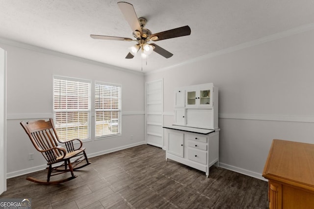 living area featuring ceiling fan and crown molding