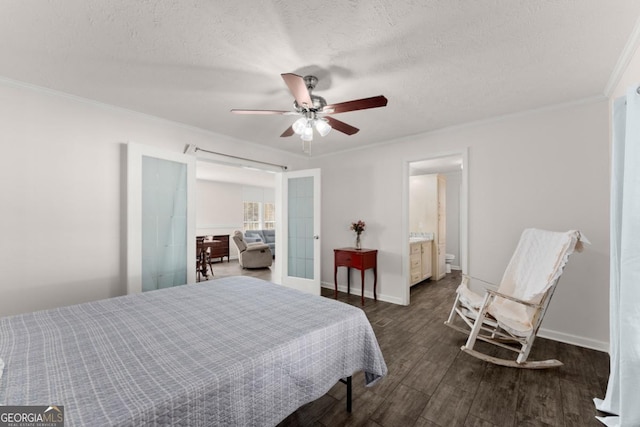 bedroom featuring french doors, ceiling fan, ornamental molding, ensuite bath, and dark wood-type flooring