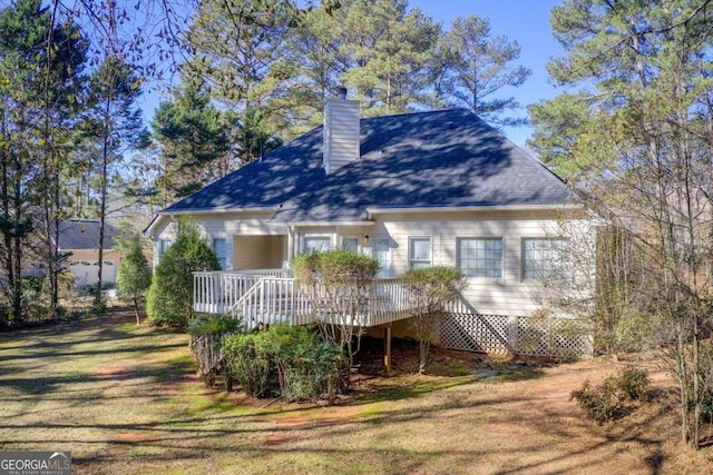 back of property featuring a deck