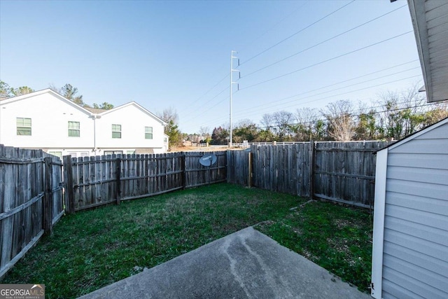 view of yard with a fenced backyard