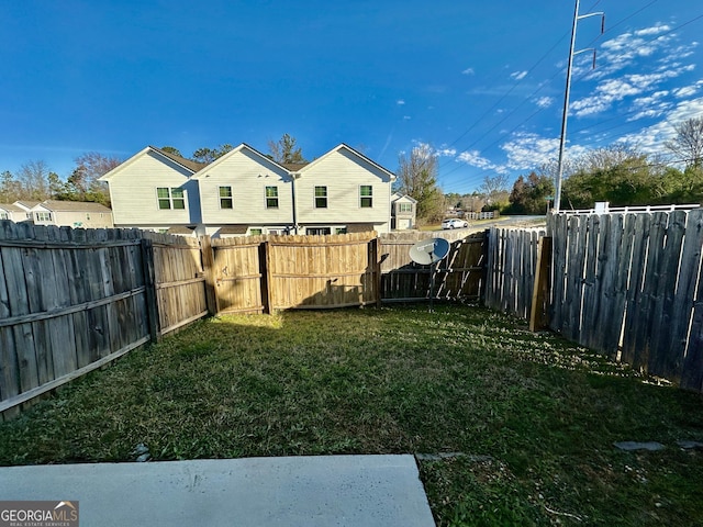 view of yard featuring a fenced backyard