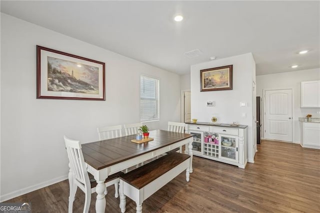 dining room with dark hardwood / wood-style floors