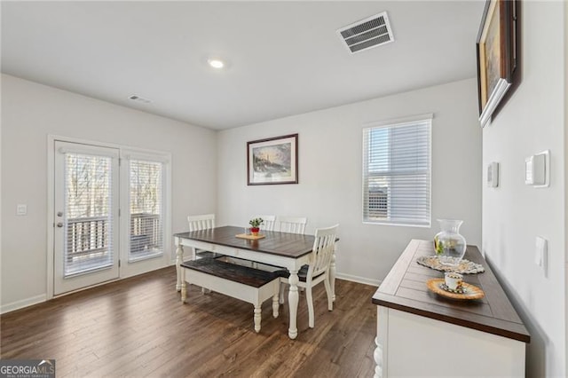 dining area with dark hardwood / wood-style floors