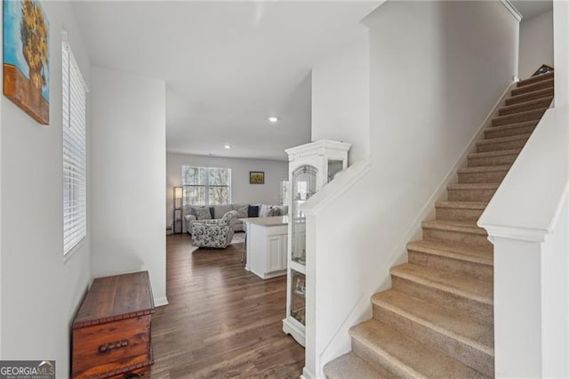 stairway featuring hardwood / wood-style flooring