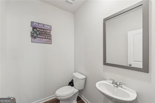 bathroom featuring sink and toilet