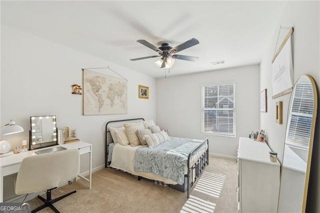 carpeted bedroom with ceiling fan