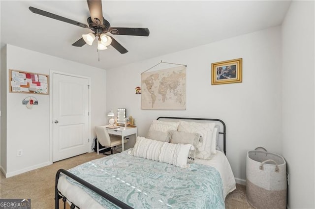 bedroom featuring ceiling fan and light colored carpet