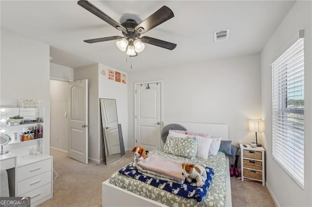 carpeted bedroom featuring ceiling fan