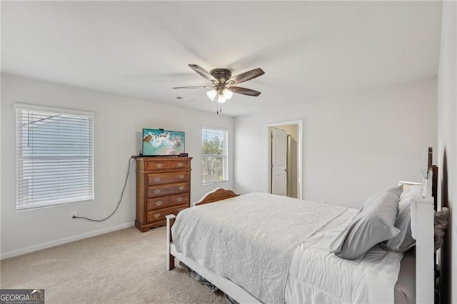 bedroom featuring light carpet and ceiling fan