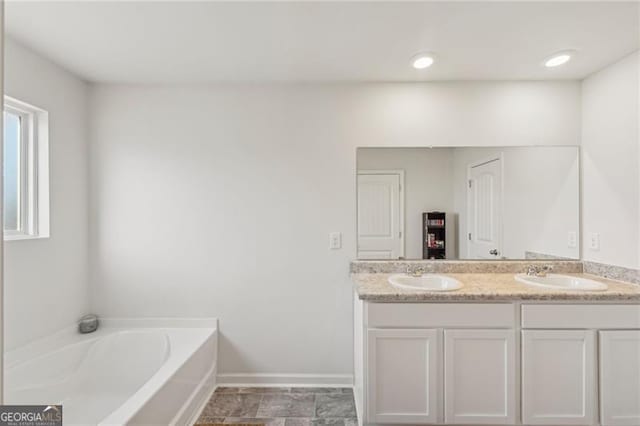 bathroom featuring a bathtub and vanity