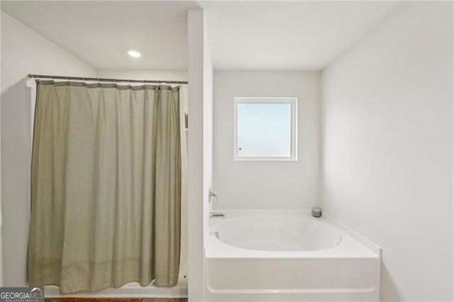 bathroom featuring a washtub