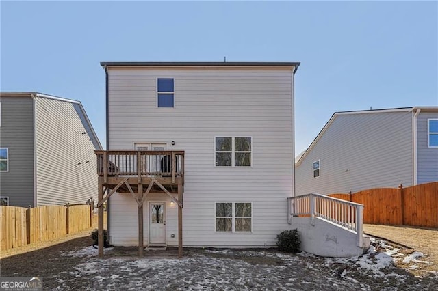 back of property featuring a balcony