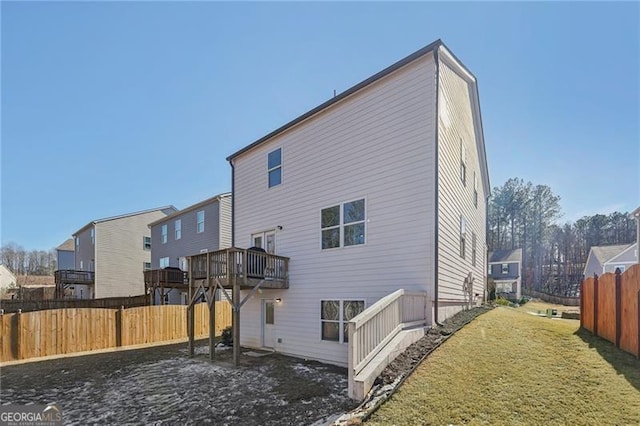 rear view of house with a yard