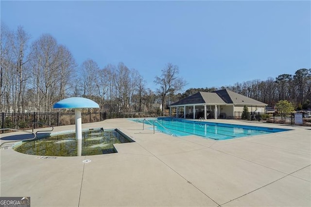 view of swimming pool with a patio area