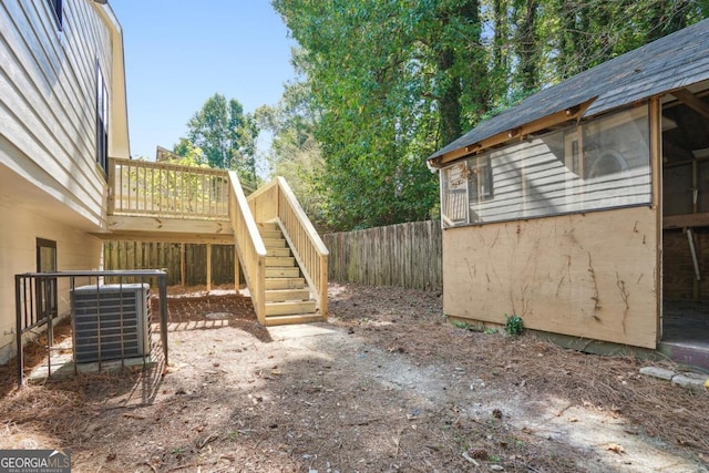 exterior space featuring central AC and a wooden deck