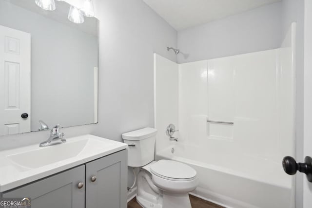 full bathroom with vanity, toilet, and tub / shower combination