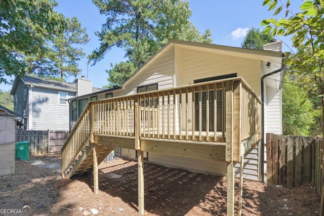 back of property with a wooden deck