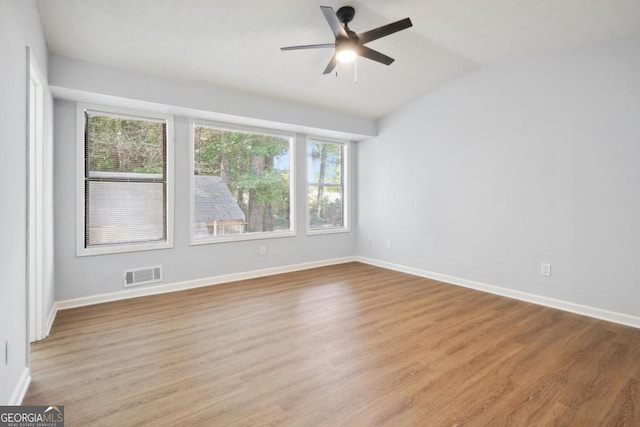 unfurnished room with light hardwood / wood-style floors, ceiling fan, and lofted ceiling