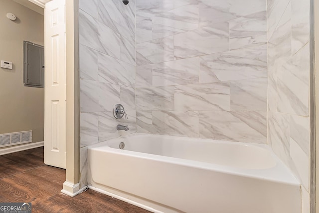 bathroom featuring hardwood / wood-style floors and electric panel