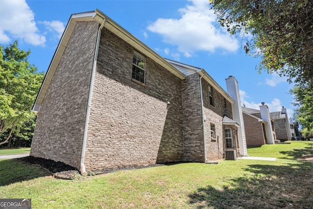 view of home's exterior with a lawn