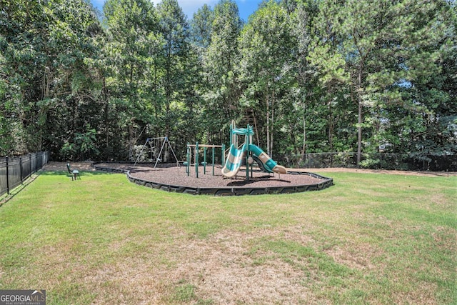 view of playground with a lawn