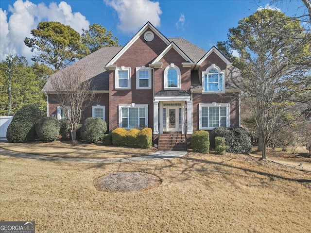 view of property featuring a front yard