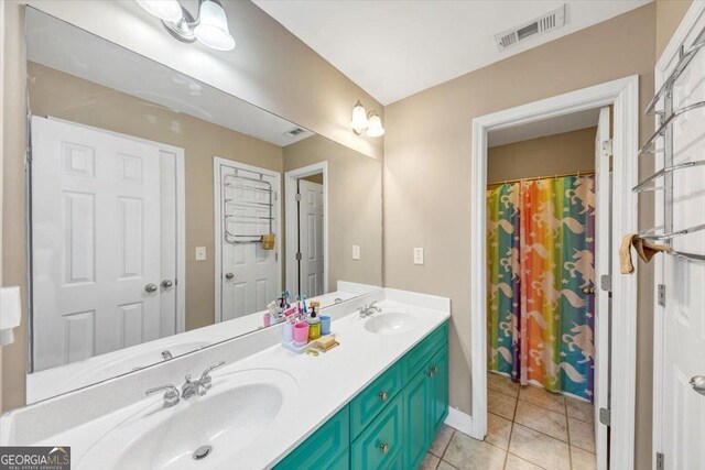 bathroom featuring vanity and tile patterned flooring