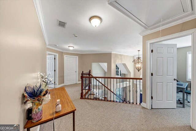 hall featuring ornamental molding and carpet flooring