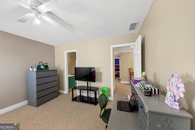 interior space featuring light carpet and ceiling fan