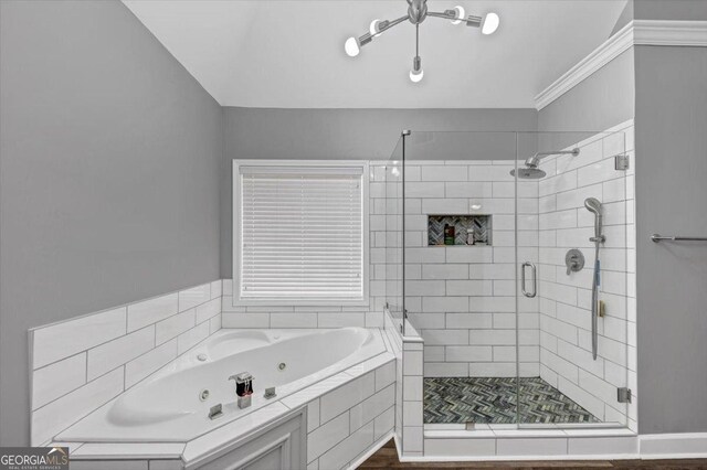 bathroom featuring crown molding and plus walk in shower