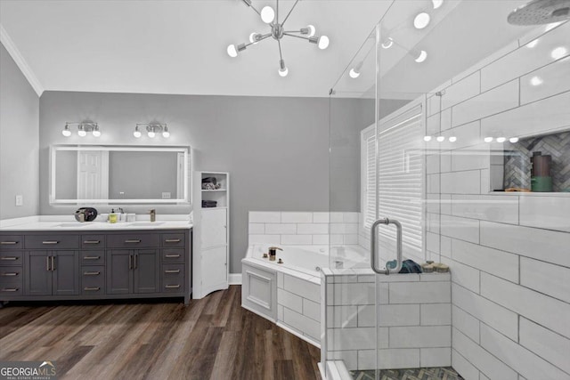 bathroom featuring crown molding, separate shower and tub, wood-type flooring, and vanity