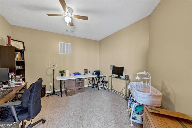 office featuring ceiling fan and carpet flooring