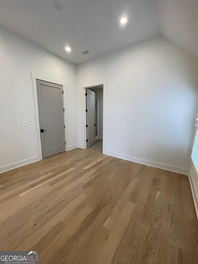 unfurnished room featuring light hardwood / wood-style floors