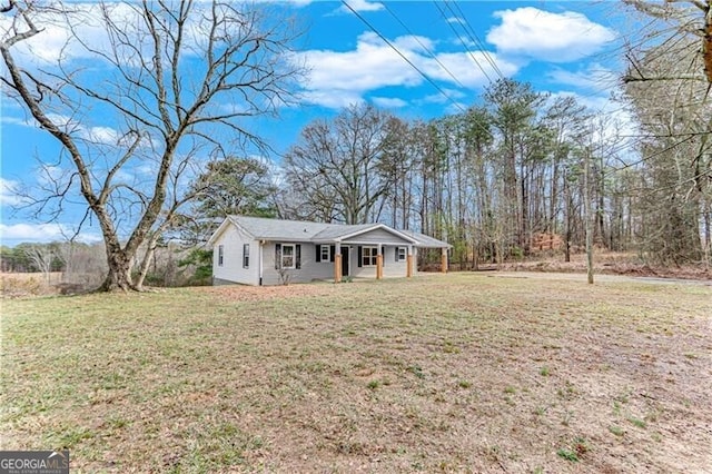 ranch-style home with a carport and a front yard