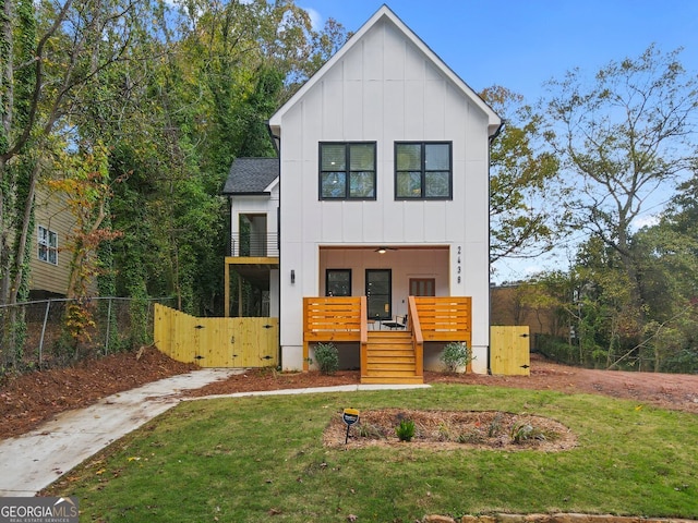 modern inspired farmhouse featuring a front lawn