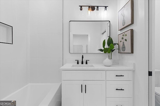 bathroom featuring vanity and toilet