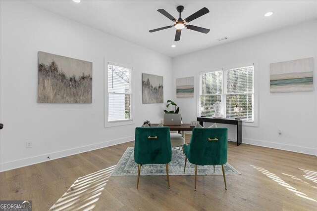 interior space with ceiling fan and hardwood / wood-style flooring