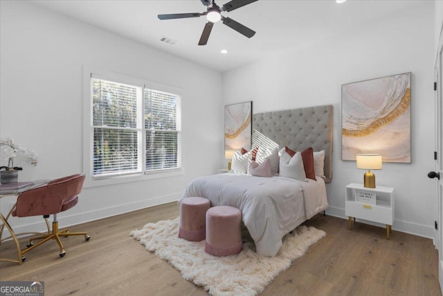 bedroom featuring ceiling fan and wood-type flooring