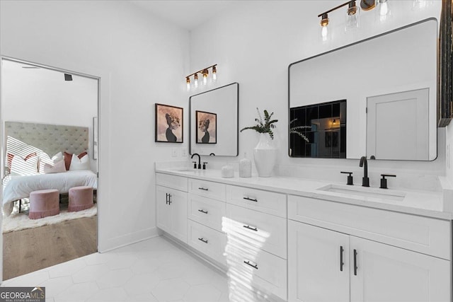 bathroom featuring tile patterned flooring and vanity