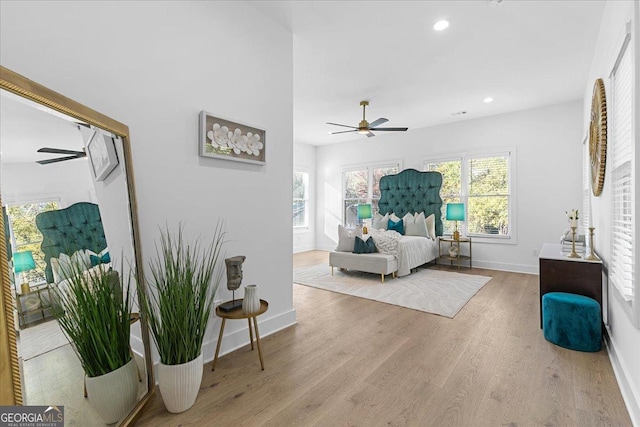 bedroom featuring ceiling fan and light hardwood / wood-style flooring