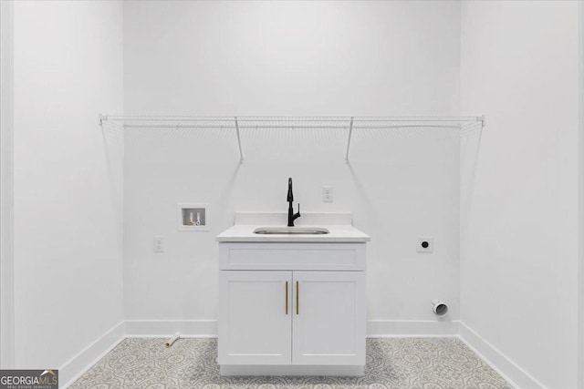 washroom with electric dryer hookup, hookup for a washing machine, and sink