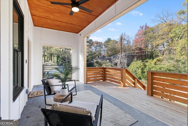 view of patio / terrace featuring ceiling fan and a deck